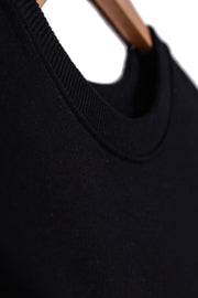 Ribbed collar detailing of men's organic cotton sweatshirt in plain black.