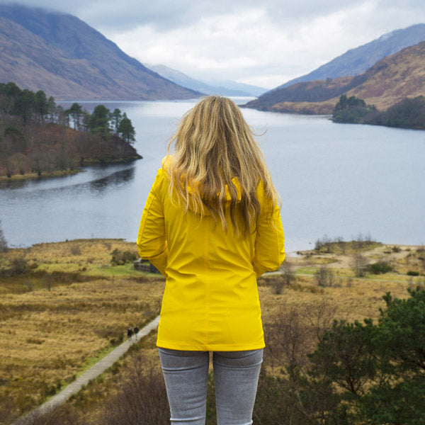 Woman wearing bright yellow winter jacket