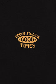 Detail of orange hand-screen printed, surf inspired logo, featuring the words Good Times
