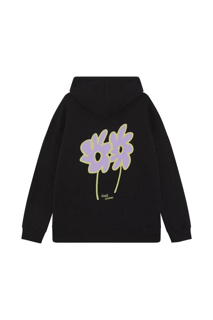 Back of unisex black organic cotton printed hoodie featuring a lilac and green flower graphic design.