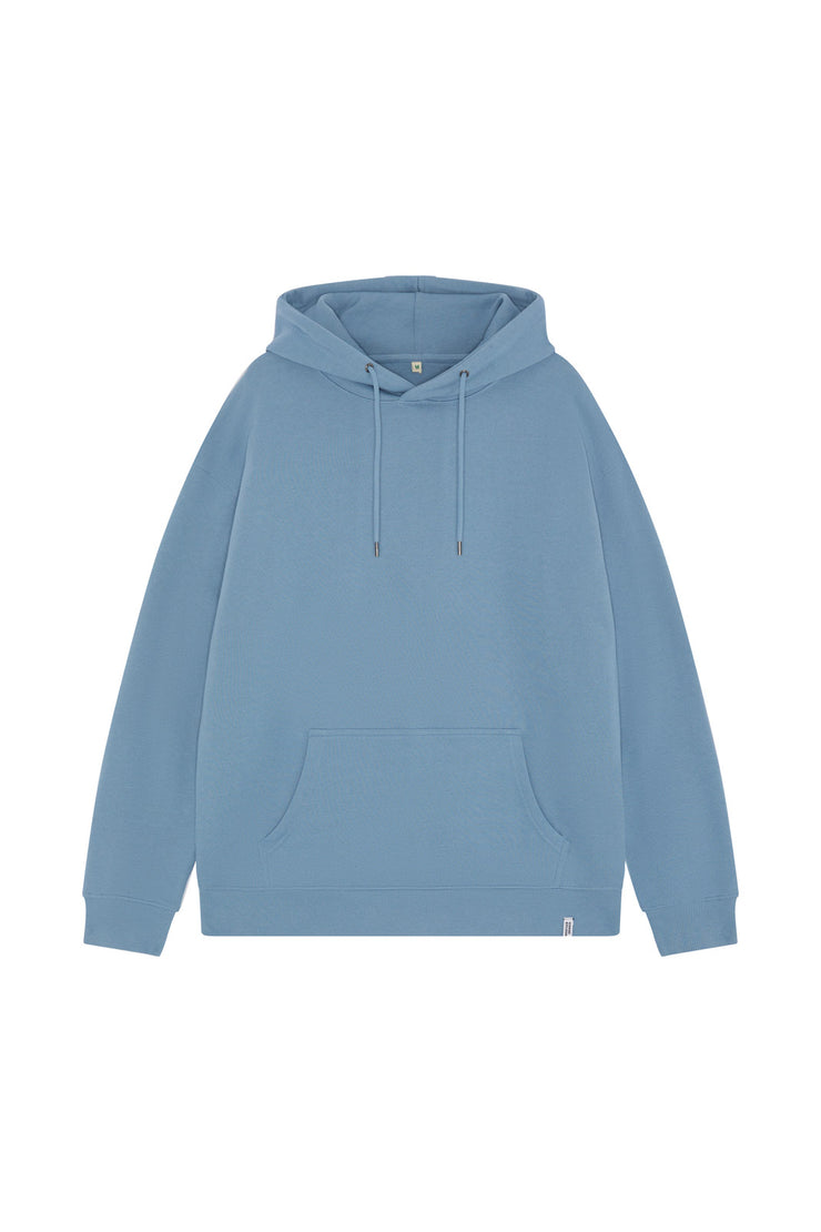 Front of unisex blue organic cotton hoodie in a drop shoulder relaxed fit