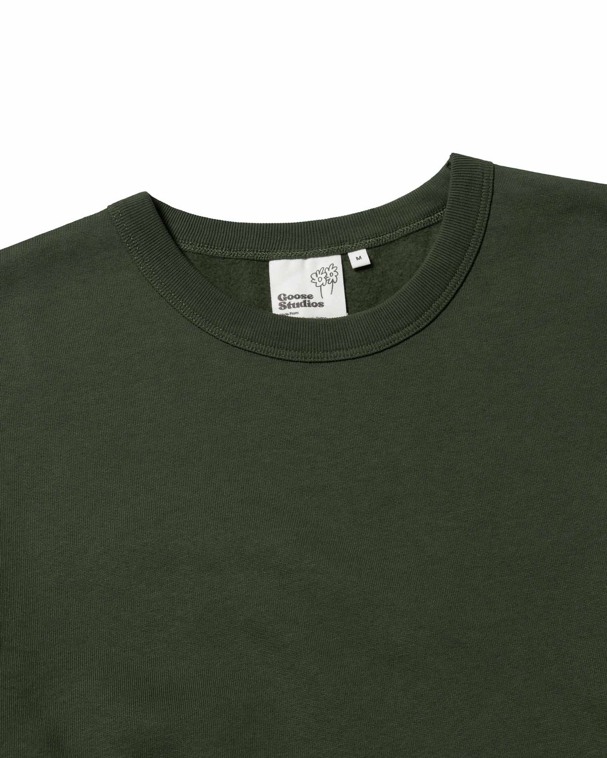 Close up detail shot of an olive green organic cotton sweatshirt with a bound 100% organic cotton collar and Goose Studios brand label