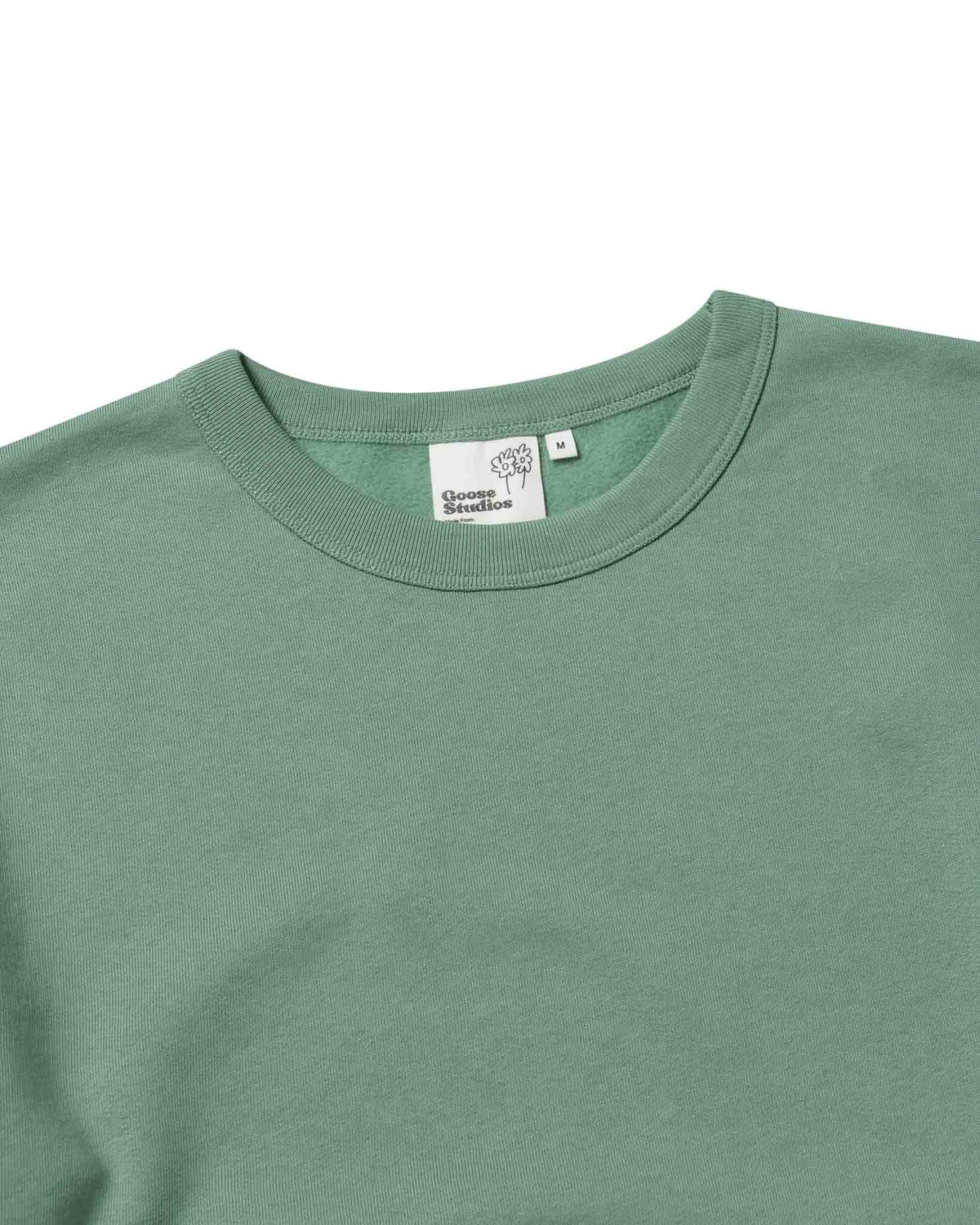 Collar detail of women's organic cotton sweatshirt in pastel green