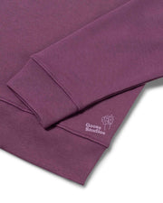 Cuff detail of women's organic cotton drop shoulder sweatshirt in berry pink