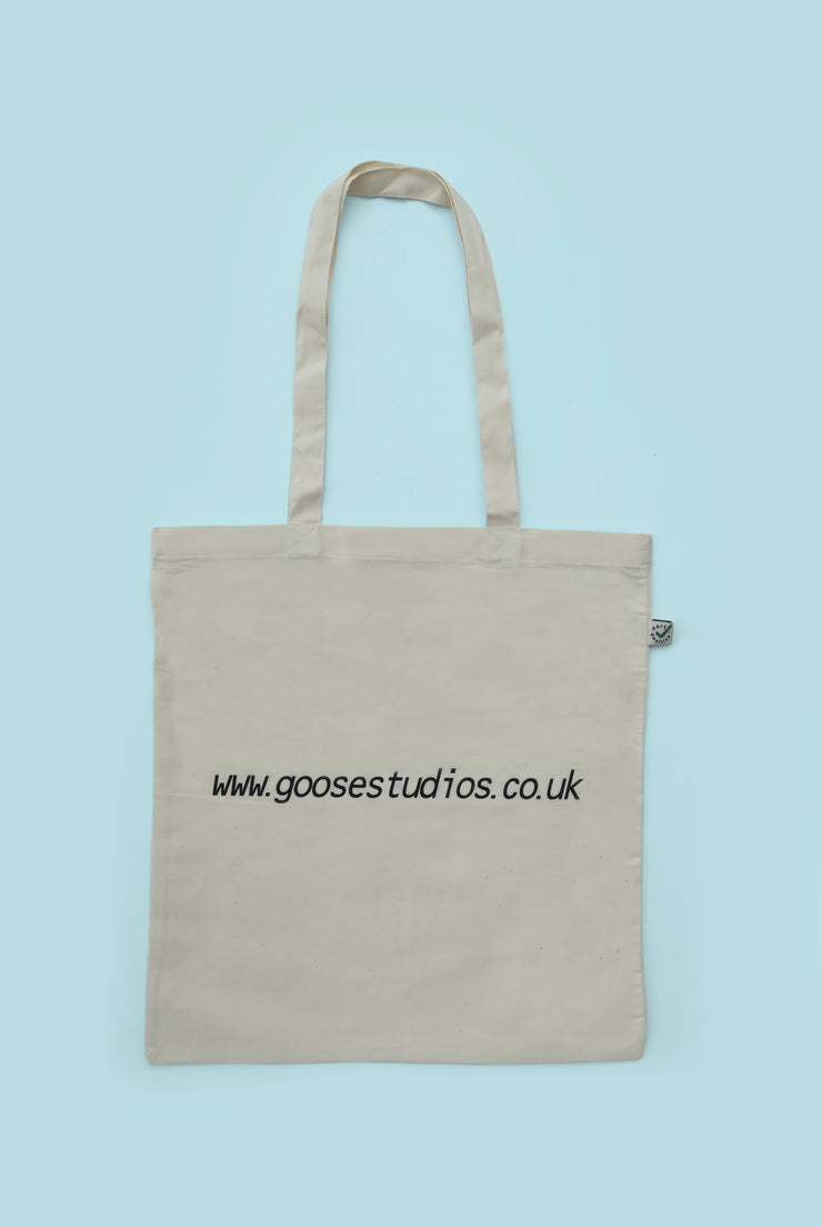 Back of printed organic cotton tote bag with black text