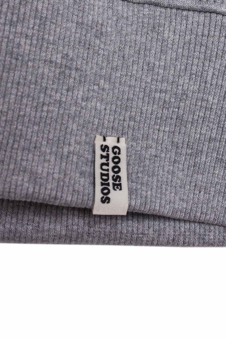Label detailing on bottom hem of grey marl organic cotton sweatshirt for men from Goose Studios