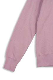 Ribbed cuffs and bottom hem detailing of men's organic cotton sweatshirt in pink.