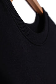 Collar detail of men's black printed organic cotton sweatshirt
