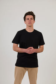 Man wearing organic cotton black t shirt