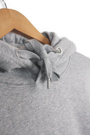 Drawstring detail on a sustainable hoodie in grey organic cotton.