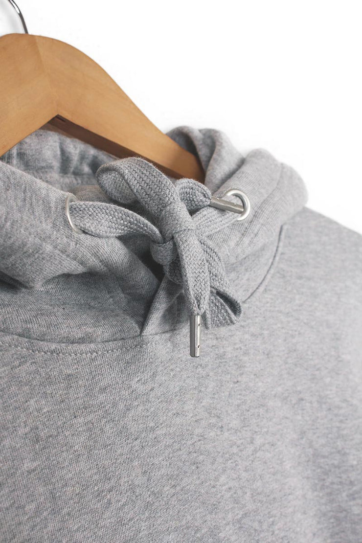 Drawstring detail on a sustainable hoodie in grey organic cotton.