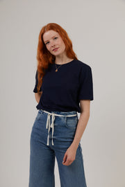 Woman wearing navy organic cotton sustainable t-shirt