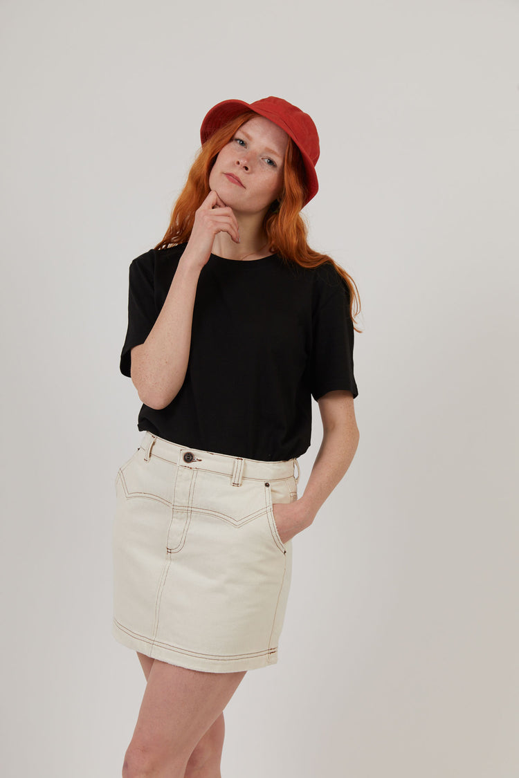Woman wearing black workwear organic cotton sustainable t shirt