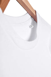 Collar detail of men's printed organic cotton long sleeve t-shirt in white