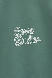 Detail of graphic printed design on women's green organic cotton sweatshirt