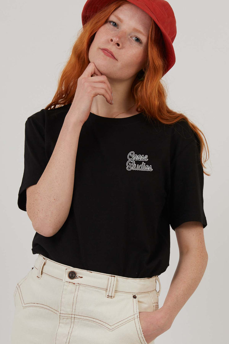 Woman wearing black boxy fit organic cotton printed t-shirt